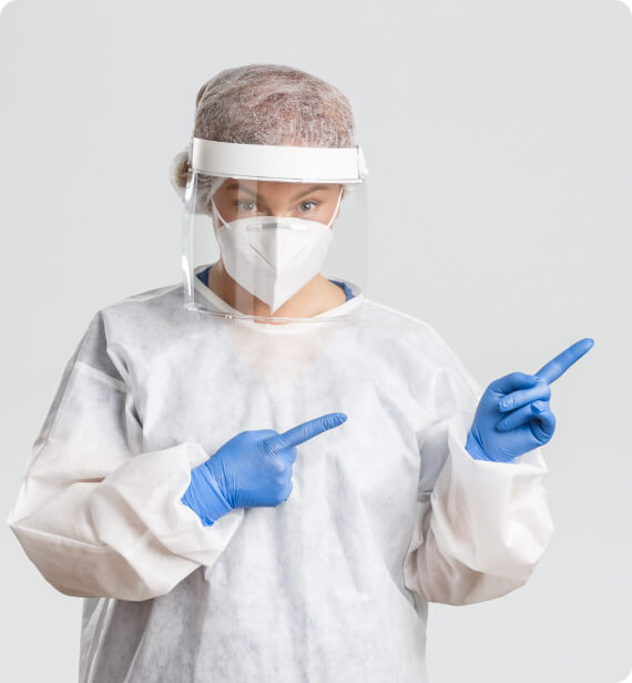 a person in a respirator is dressed in a white coat